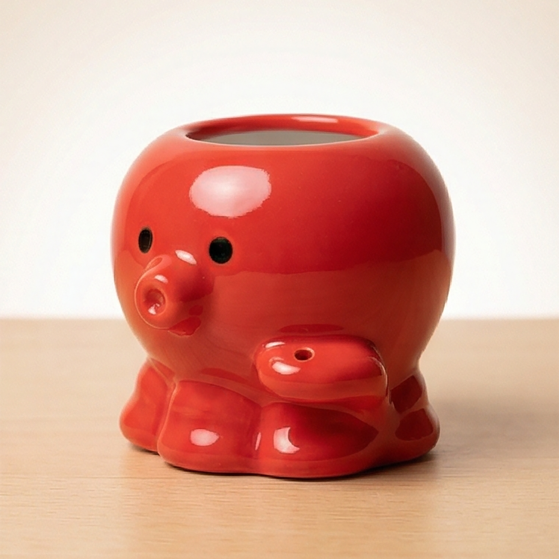 Seitenansicht des roten Takoyaki-Octopus Zahnstocherhalters mit sichtbaren Tentakel-Armen